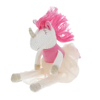 Knitted unicorn toy wearing a pink top and skirt