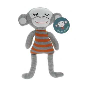 Knitted monkey toy with a grey bodyand wearing an orange and grey striped shirt with tag