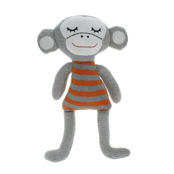 Knitted monkey toy with a grey body and wearing an orange and grey striped shirt.