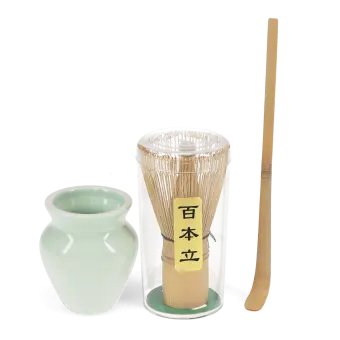 Matcha whisk set with bamboo whisk in container, ceramic holder, and bamboo scoop