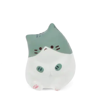 Green and white squidgy stress cat in a sitting design