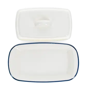 Rectangular white enamel butter dish with a blue rim, shown with the lid on the side