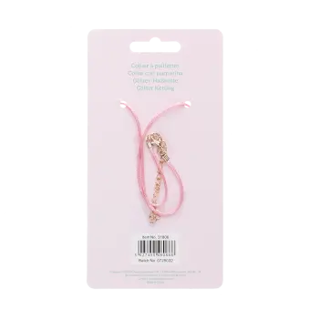 back of unicorn glitter necklace packaging with safey warnings in mulitliingual 