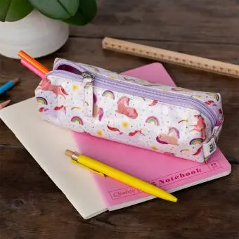 Pencil case in pink featuring colourful illustrations of unicorns, rainbows and stars