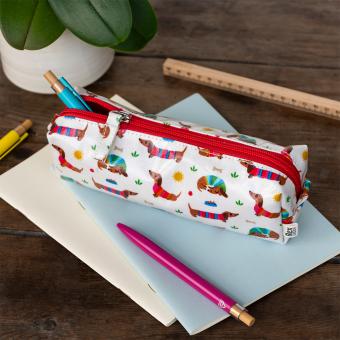 Pencil case in white featuring colourful illustrations of sausage dog 