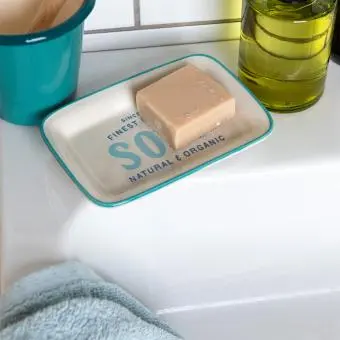 Rectangular ceramic soap dish with a light blue border and printed text 'SOAP'