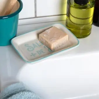 Rectangular ceramic soap dish with a light blue border and printed text 'Salle de bain' 