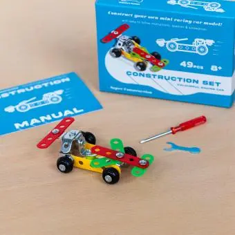 Completed colourful racing car model displayed with its packaging box
