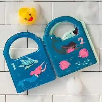 Colour Changing Bath Book' featuring colourful illustrations of mermaids, fish, and underwater scenes