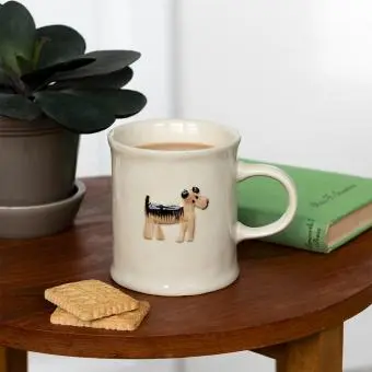 Stoneware mug featuring a dog with handle 