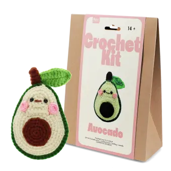 Avocado crochet kit with packaging and finished crocheted avocado beside it