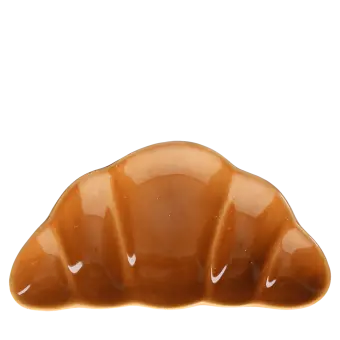 Brown ceramic trinket dish shaped like a croissant.