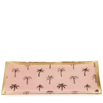 Rectangular trinket dish with gold rim and palm tree pattern on a pink background