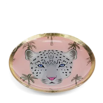Round trinket dish with gold rim, pink background, palm tree pattern, and a leopard face design