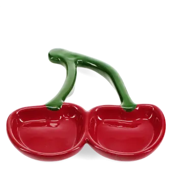 Red ceramic trinket dish shaped like two cherries with green stems.