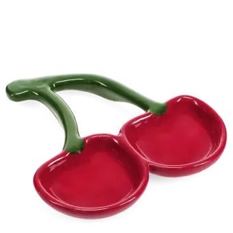 Red ceramic trinket dish shaped like two cherries with green stems.