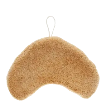 Back of a brown kitchen cloth shaped like a croissant with hanging loop
