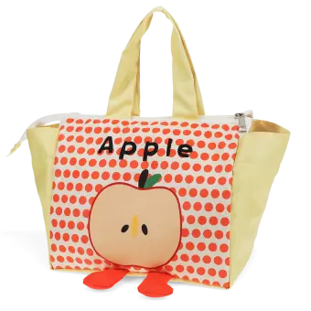 Yellow handbag with red polka dots and a cartoon apple design with two red feet at the bottom