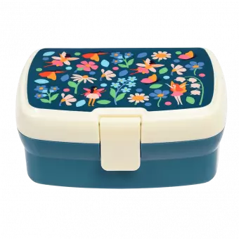 Dark blue lunch box with cream and dark blue lid featuring print of fairies amongst flowers