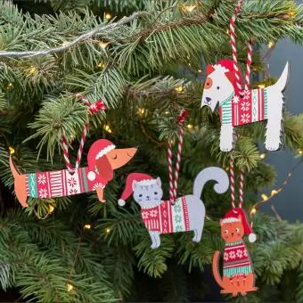 Wooden hanging Christmas decorations dogs and cats collection on tree