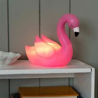 Pink flamingo night light shown with light on