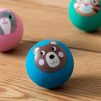 Blue bouncy ball with a bear face design