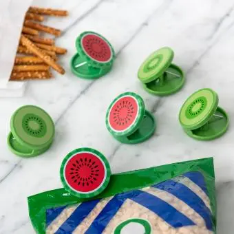 Six round bag clips shaped like kiwi and watermelon slices in green and red