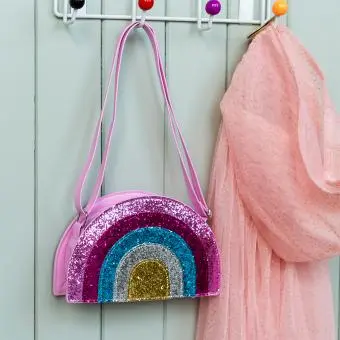 Children’s glitter rainbow handbag with colourful arcs and a pink strap