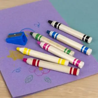 Six jumbo wooden crayons in different colour with a blue sharpener. 