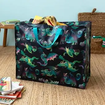Large storage bag with a multi‑coloured dragons on a dark blue background and turquoise handles.