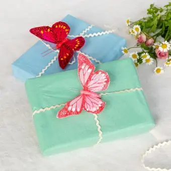 Two bright pink butterfly clip‑on decorations.