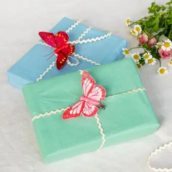 Two small bright pink butterfly clip‑on decorations.