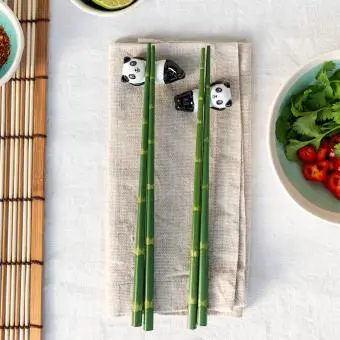 Green bamboo-themed chopsticks set with two panda ceramic rests