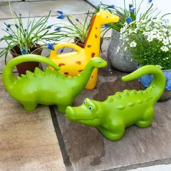 Brightly coloured animal‑shaped watering cans, including a dinosaur, giraffe and crocodile.
