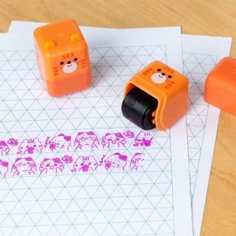 Kitten-themed roller stamp with the cap removed.