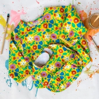 Bright floral bib and vest set with matching colourful pattern