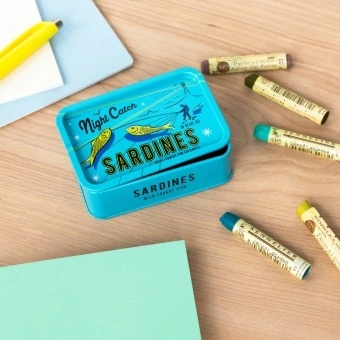 Turquoise mini storage tin with a sardine illustration on the front.
