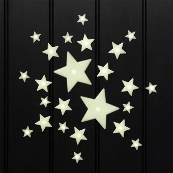 Glow‑in‑the‑dark star shapes in different sizes on a black background.