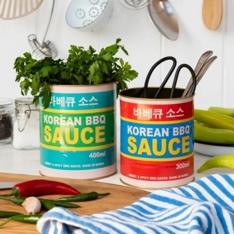 Two colourful Korean BBQ sauce storage tins
