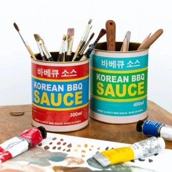Two colourful Korean BBQ sauce storage tins
