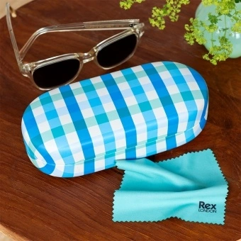 Blue gingham-patterned sunglasses case with cleaning cloth on a wooden table.