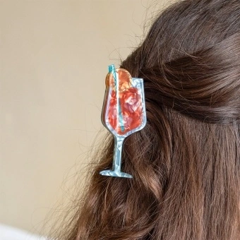 Hair claw clip featuring a zesty Aperitivo Spritz cocktail design, with hints of marbling and translucence. 