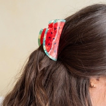 Hair claw clip featuring a fruity watermelon slice design, with hints of marbling and translucence. 