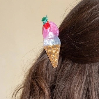 air claw clip featuring a delicious ice cream on a cone design, in multiple colours, with hints of marbling and translucence.