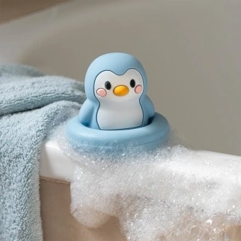 Blue silicone bath toy in penguin design