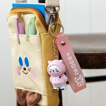 Polar bear bag charm with pink hoodie, silicone wrist strap and silver keyring