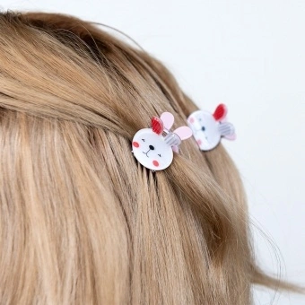 Set of two mini rabbit-shaped hair claw clips with white faces and pink ear details.