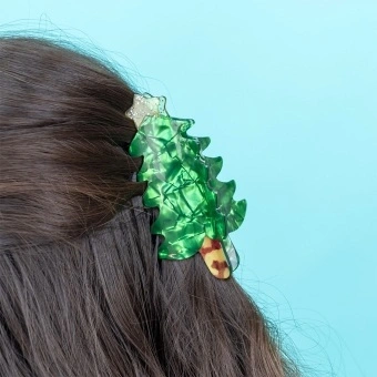 Green Christmas tree-shaped hair claw clip with a glittery gold star topper.