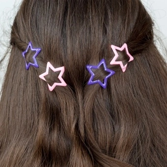 Purple and pink star hair clips in a set of four.