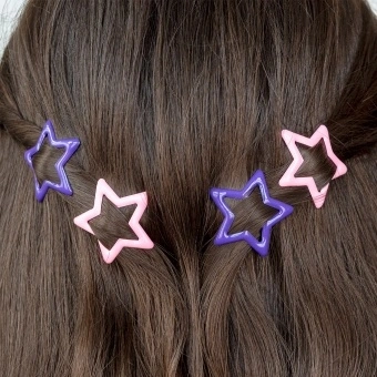 Purple and pink star hair clips in a set of four.